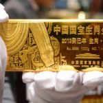Gold halts ground on speculations for increased demand, Fed stimulus outlook