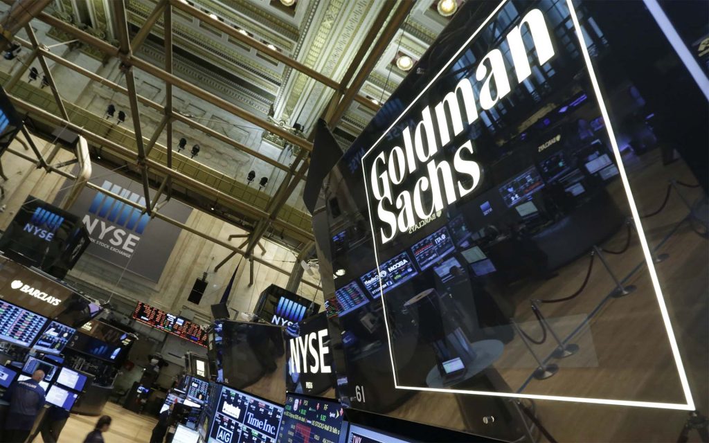 Goldman Sachs shares close lower on Monday, group to merge private-investing units, WSJ reports