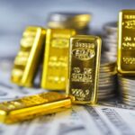 Gold Pulls Back From Record High as Dollar Weakens