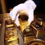 Gold Stays Near Record High as Dollar Slide Continues