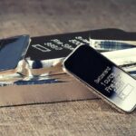 Silver eases from 1-week high on firm dollar, yields