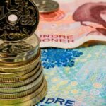 NOK Gains on Energy Strength, Tighter Norges Outlook