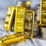 Gold Holds Higher as Dollar Softens, Fed Caps Rally Now