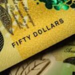 AUD/USD slides below 0.7000 as tensions lift dollar