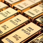 Gold Holds Modest Gains as Fed, Iran Risks Balance