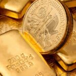 Gold Slides Toward Two-Week Low as Dollar, Fed Bite On