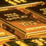 Gold Recovers Slightly as Strong Dollar Caps Gains