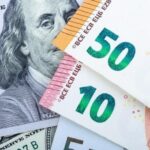 Euro Slides as Dollar Gains on Fed Rate Outlook