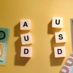 AUD Holds Steady as Mideast Risks Lift USD Before NFP