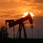 Oil gains as inventories fall